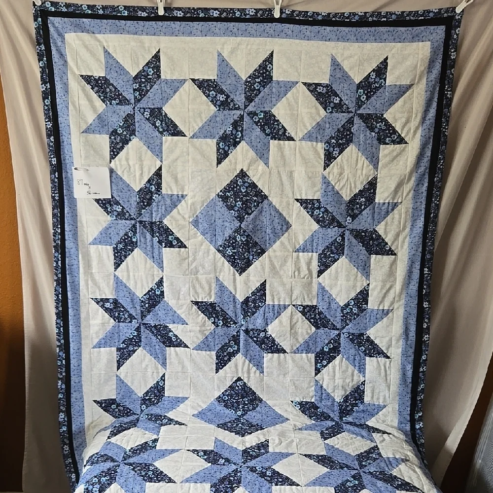 Blue and White Star Pattern Quilt